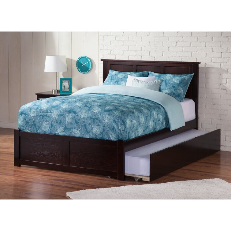 Full size bed with trundle outlet underneath